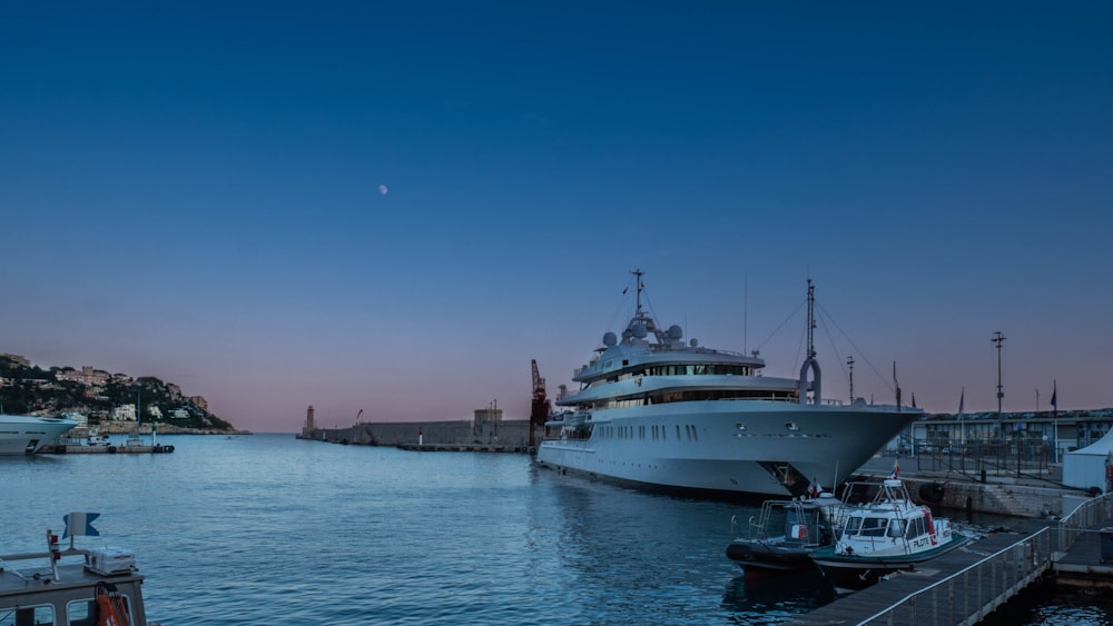 white cruise ship on sea under blue sky during daytime