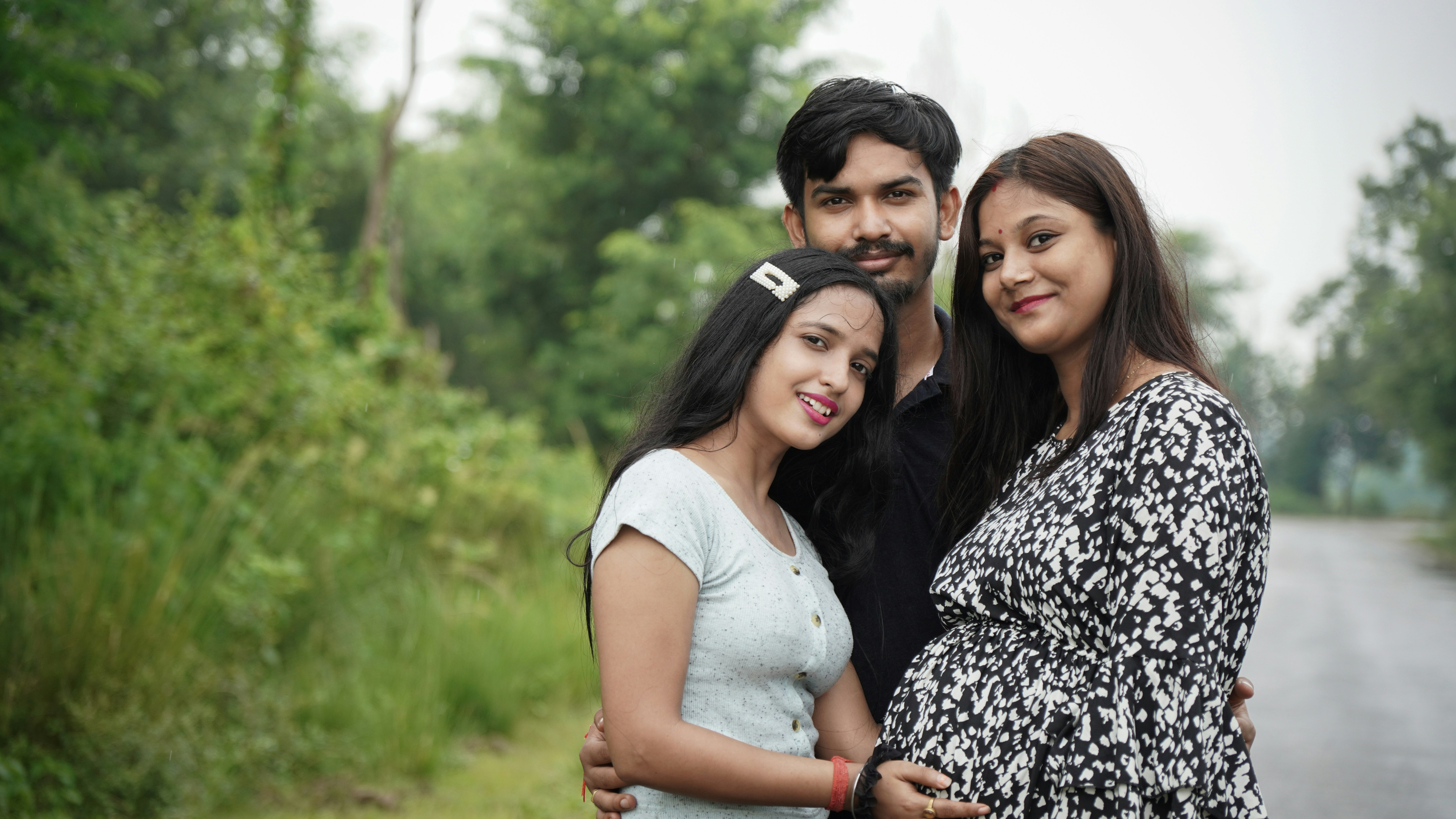 3 women and 2 men smiling