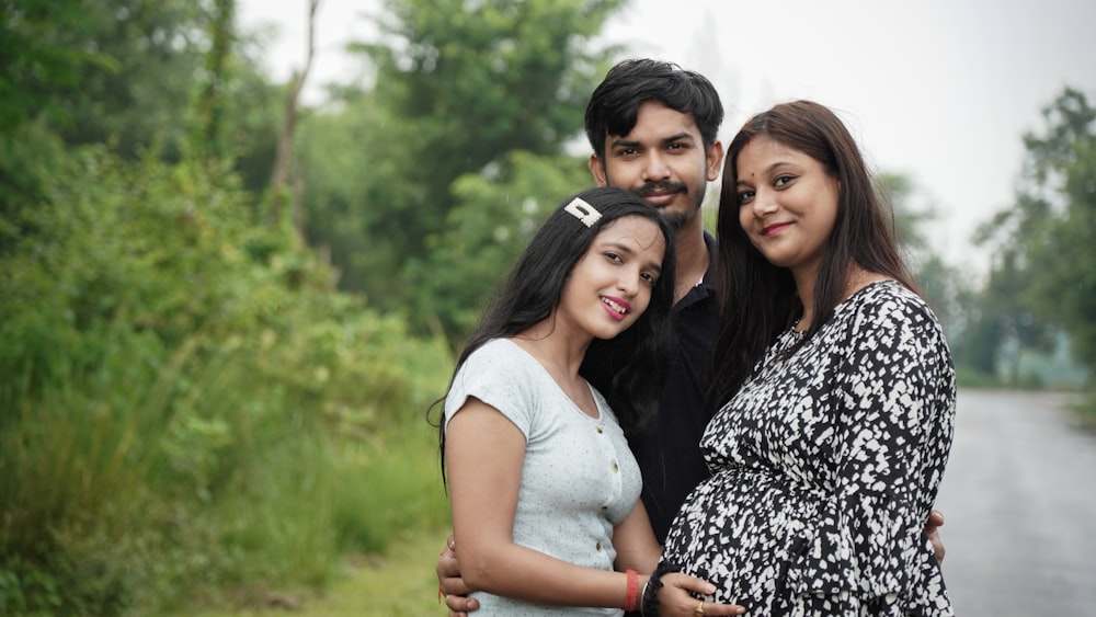 3 women and 2 men smiling