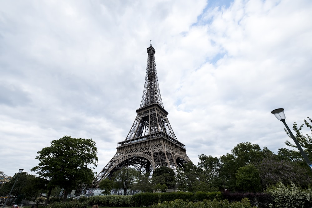 eiffel tower under white clouds during daytime