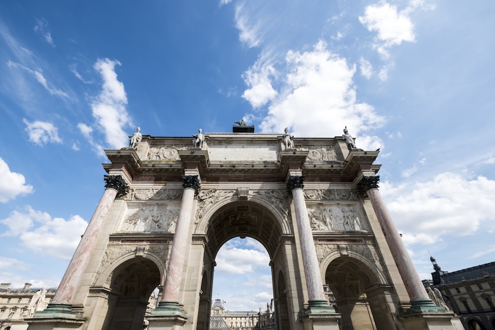 white concrete arch under blue sky during daytime