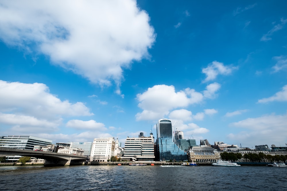 city skyline under blue and white sunny cloudy sky during daytime