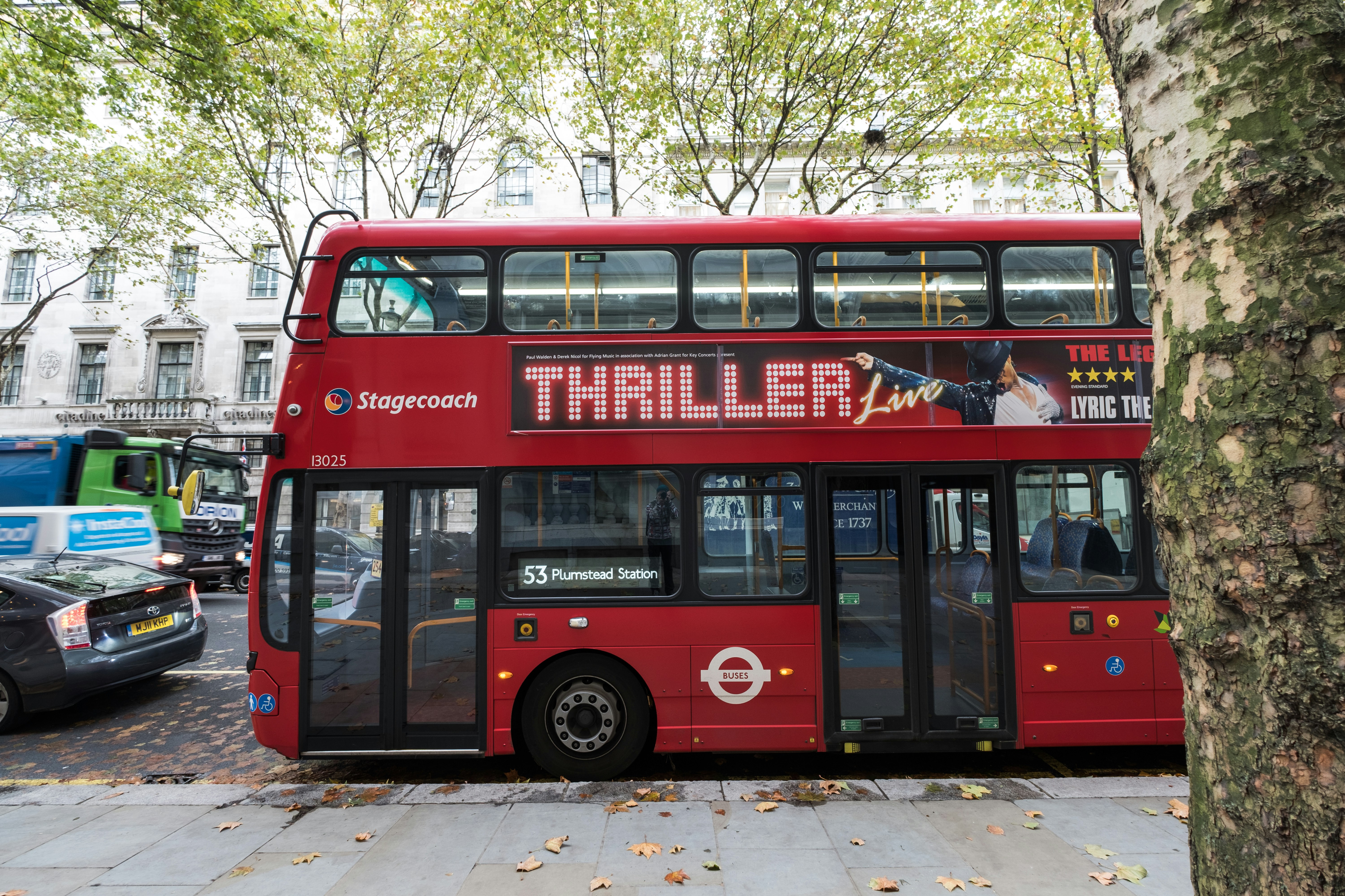 red double decker bus on road during daytime