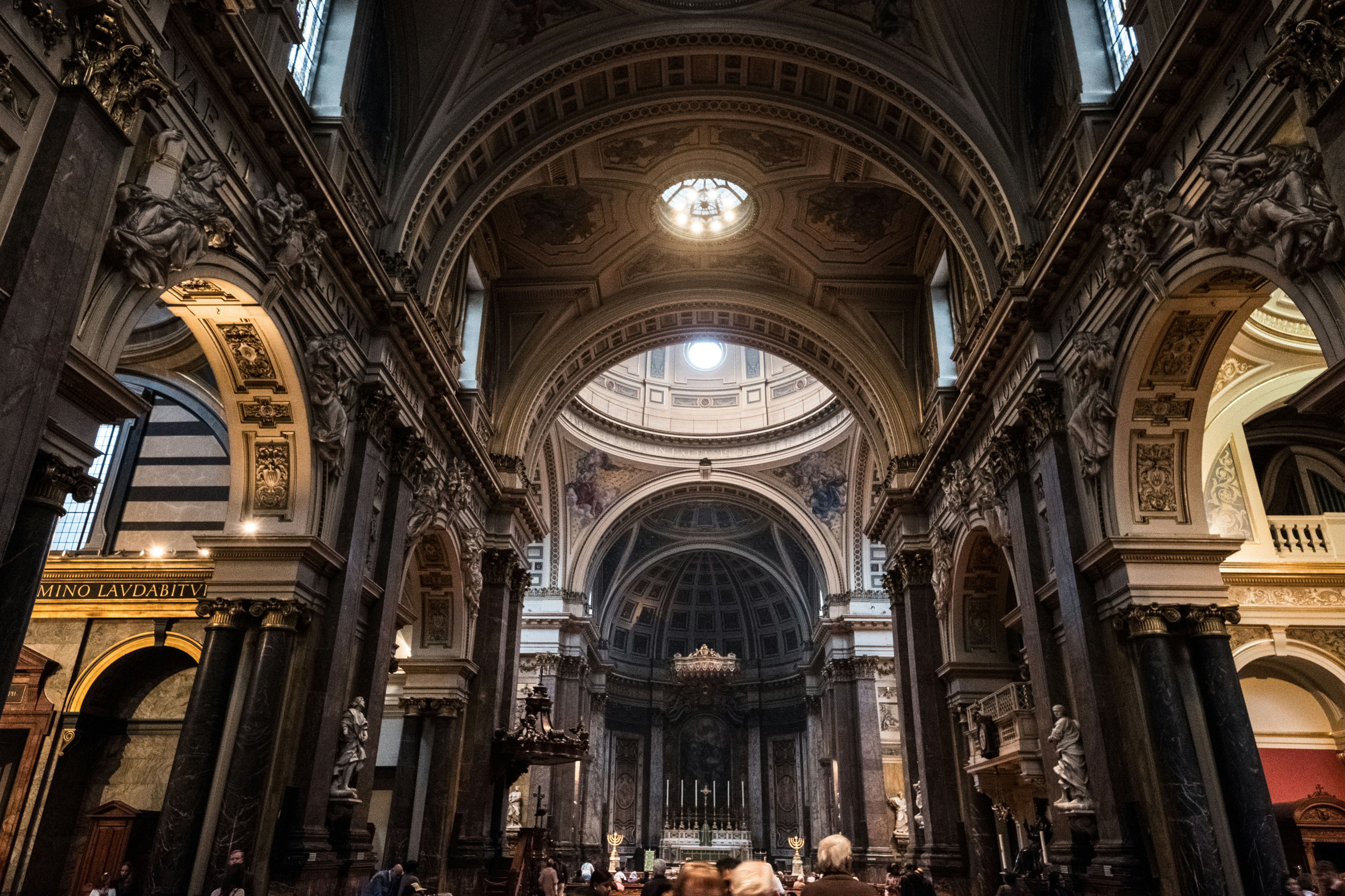 people walking inside brown concrete building