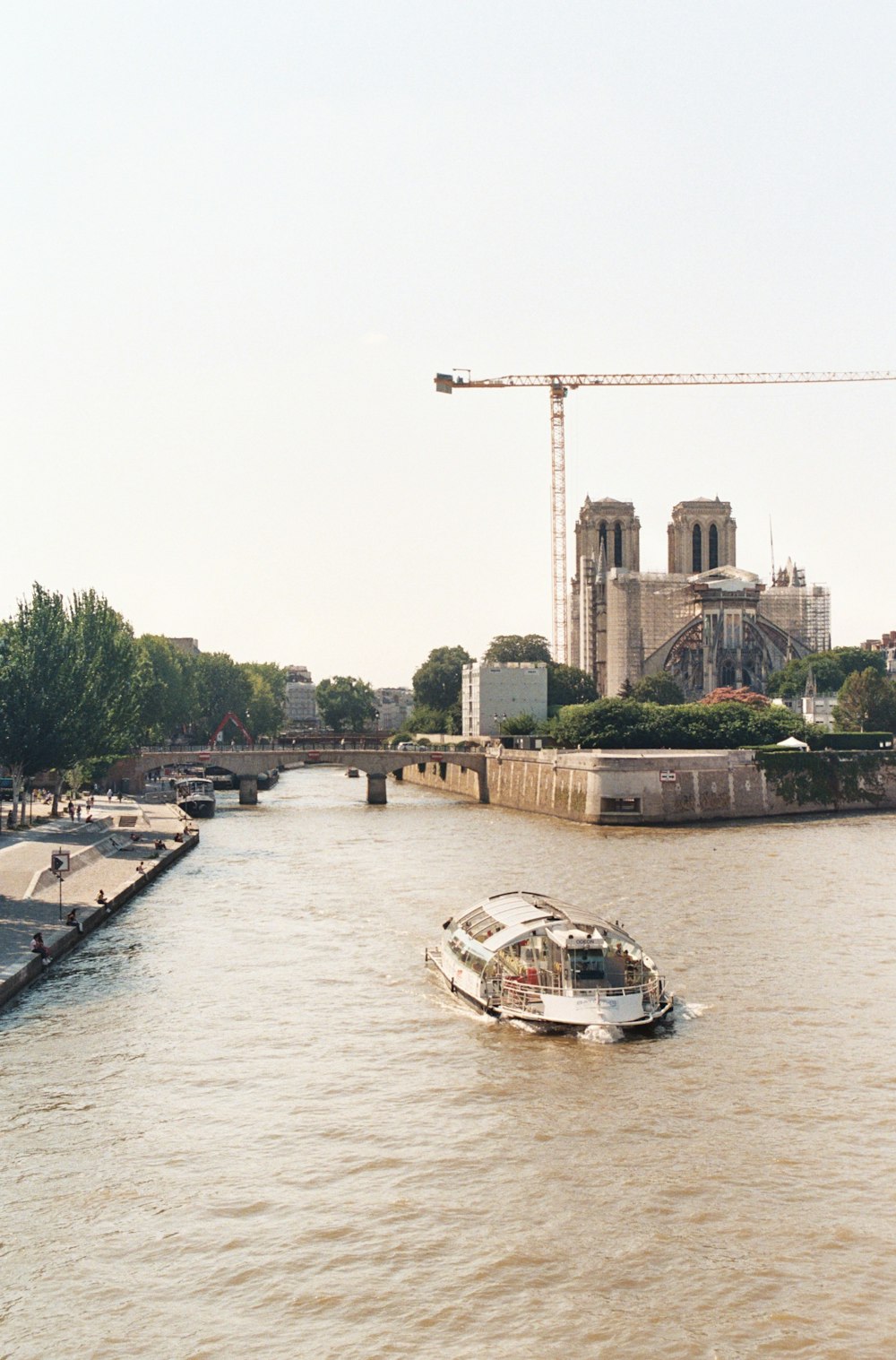 white and black boat on river during daytime