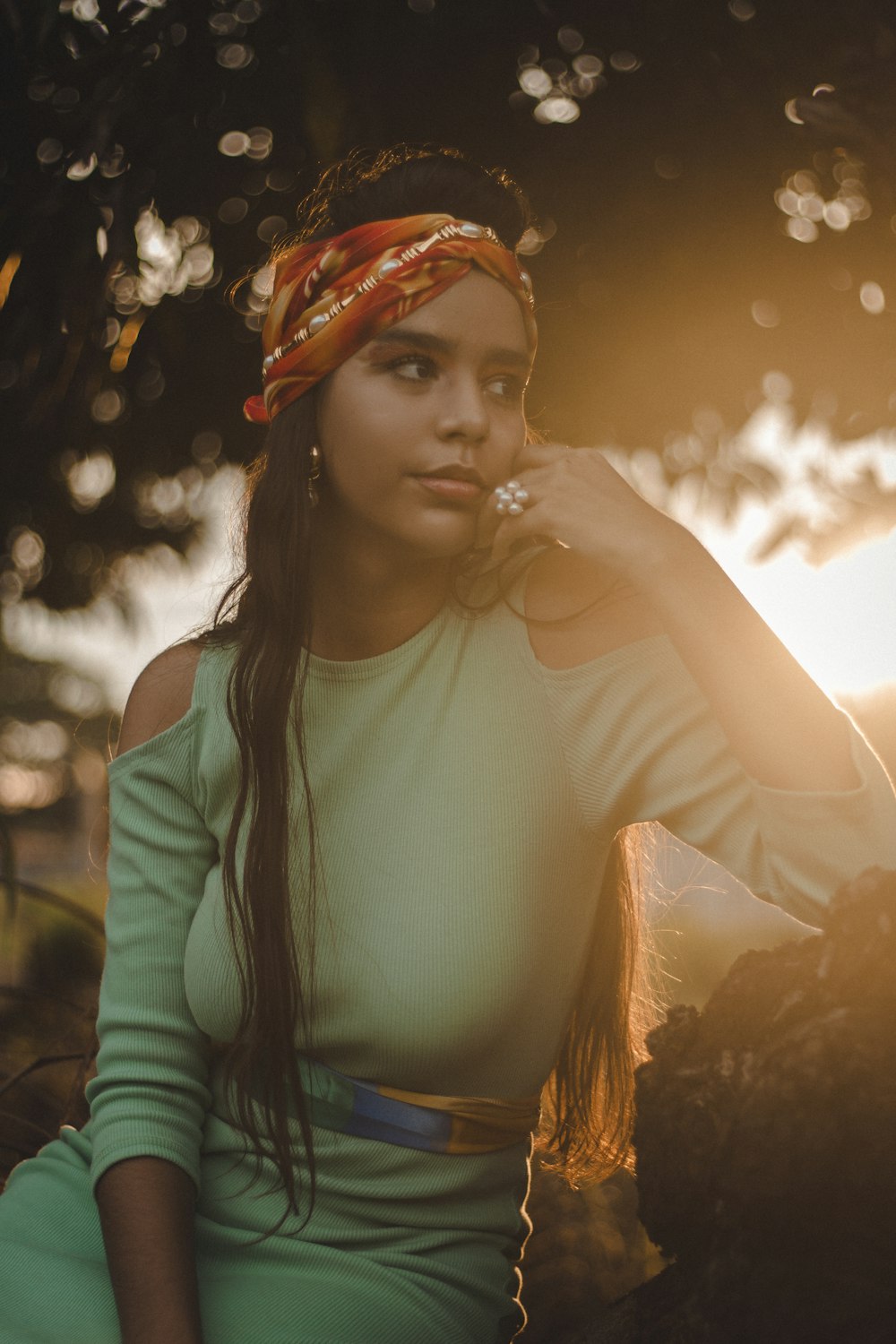 woman in white long sleeve shirt with orange scarf