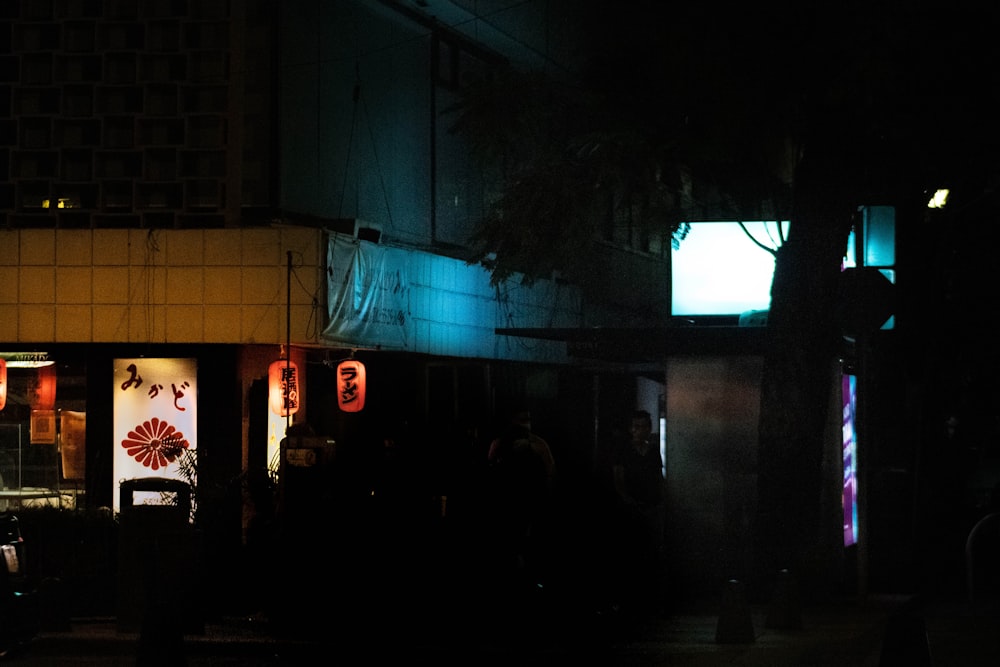 people walking on street during nighttime