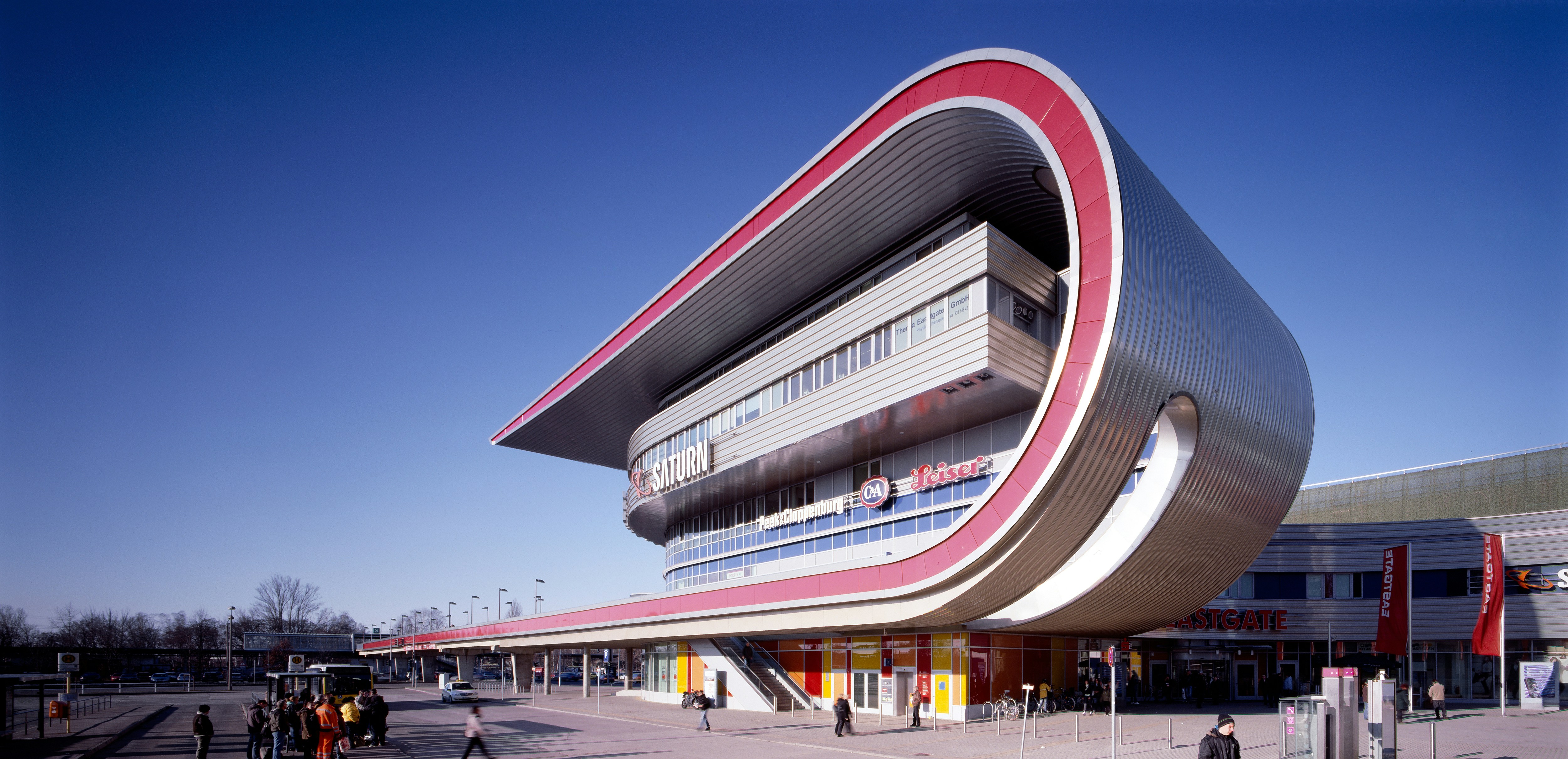 people walking on the street near white and brown building during daytime