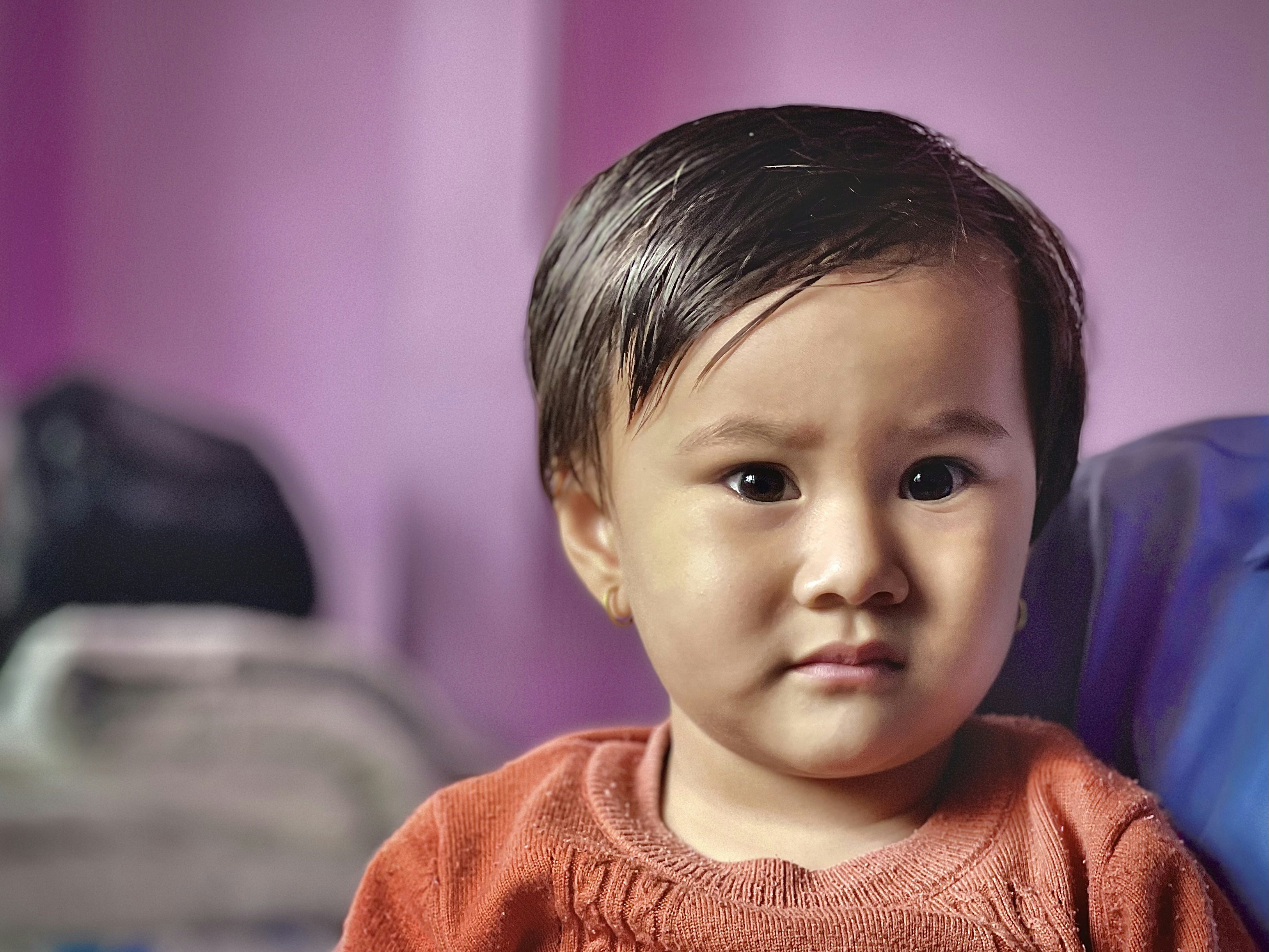 girl in orange knit sweater