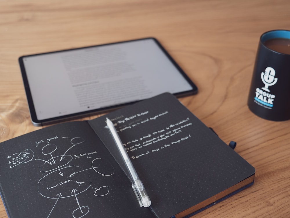 black and white pen on brown wooden table