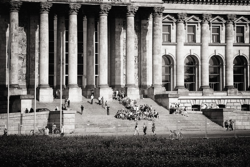 people walking on pathway near building during daytime