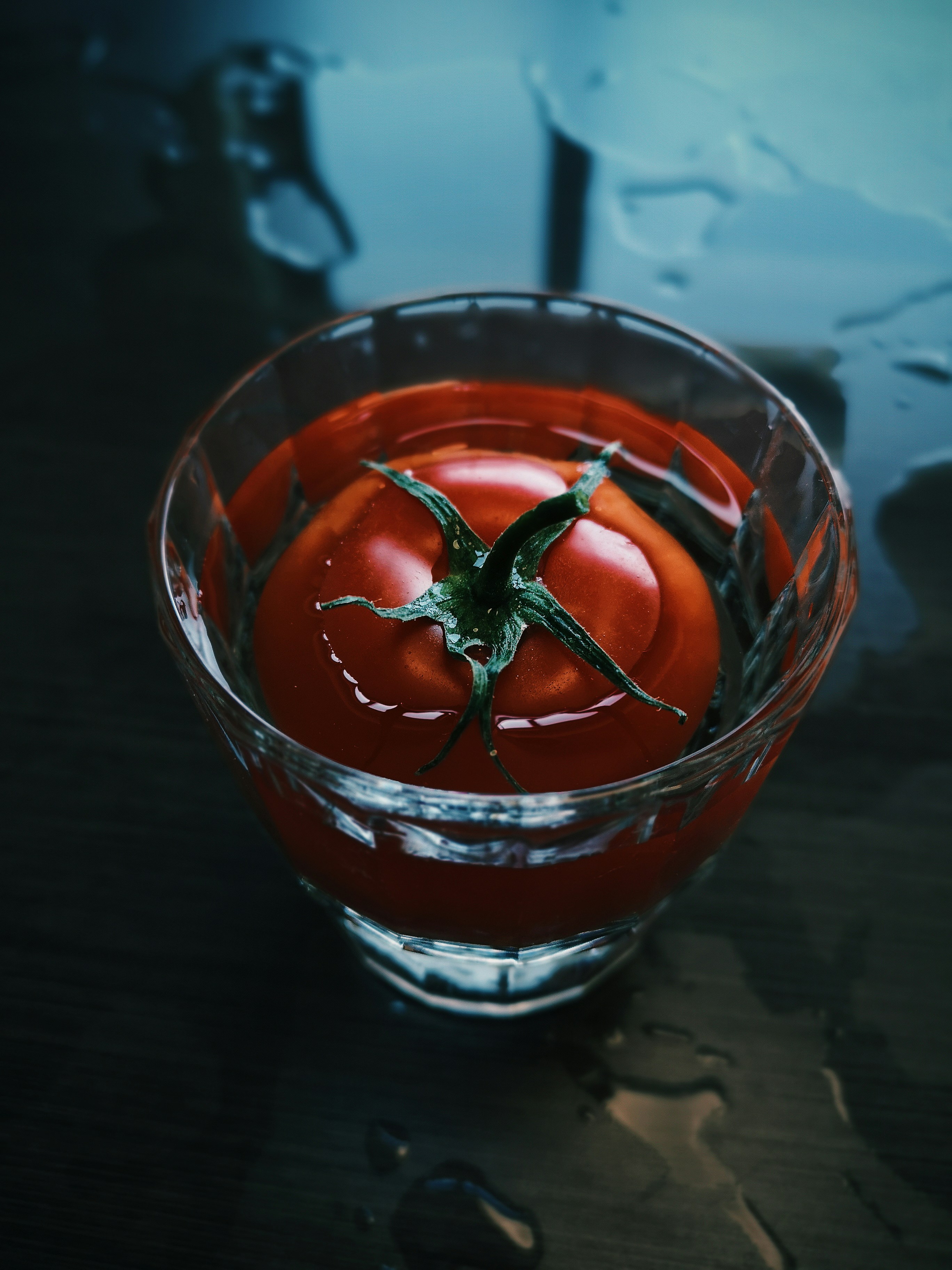 clear glass cup with red liquid