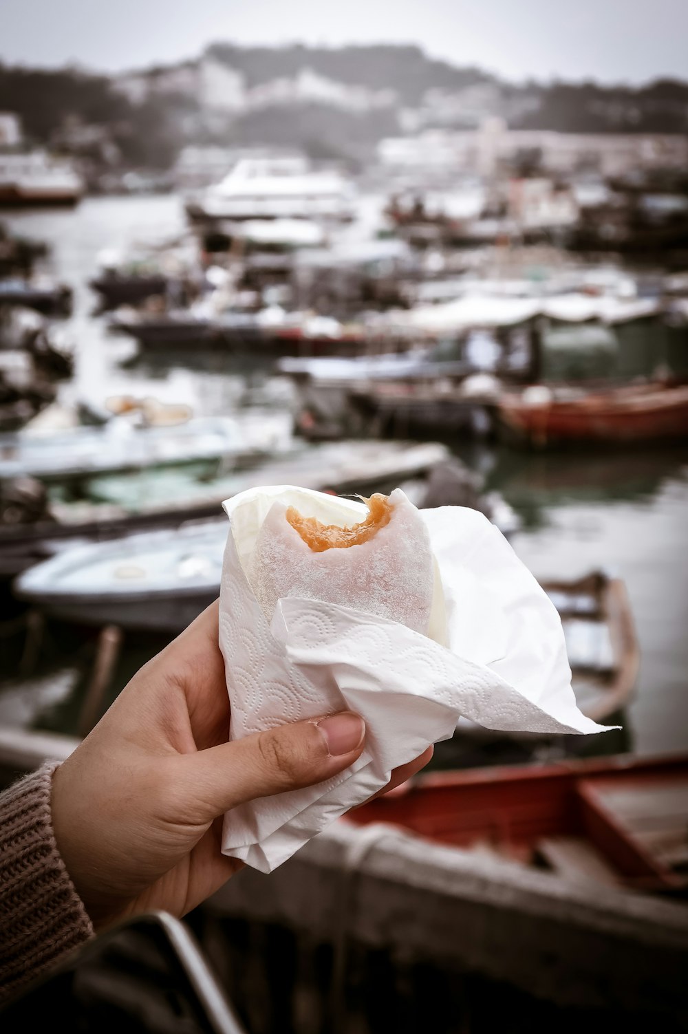 person holding white tissue paper