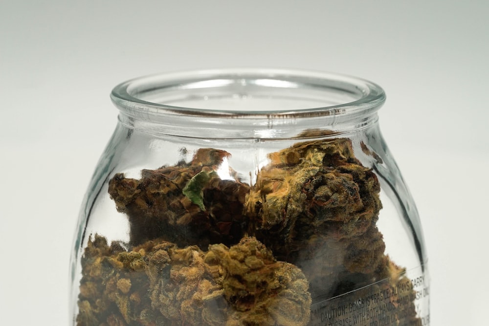 green kush in clear glass jar