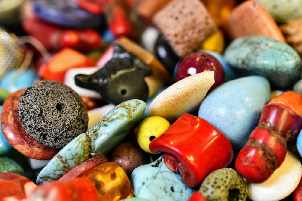 assorted color of stones on white surface