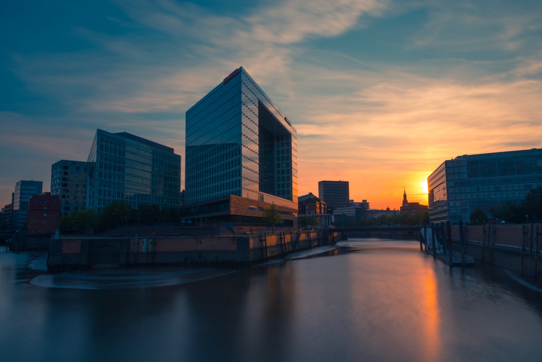 city buildings near body of water during daytime