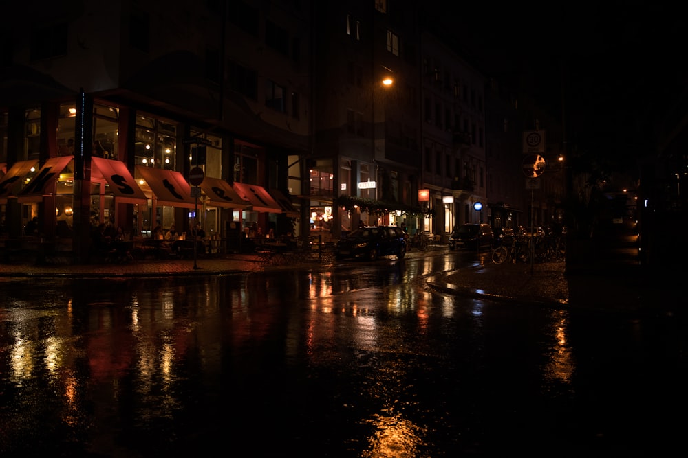 people walking on street during night time