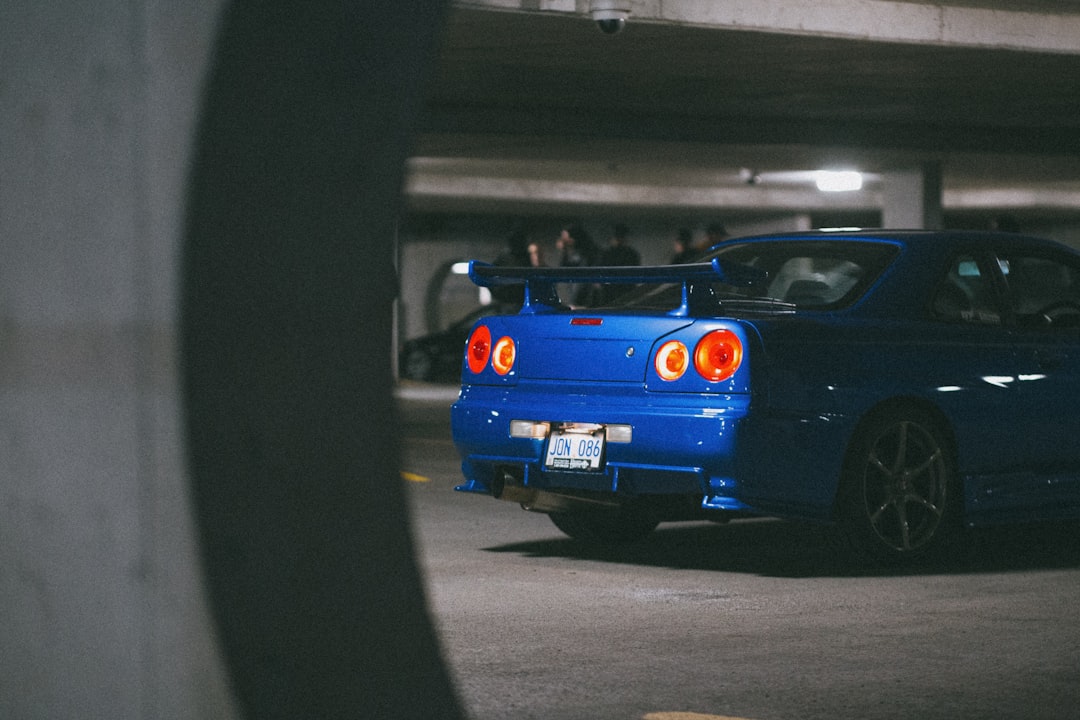 blue car on gray asphalt road during daytime