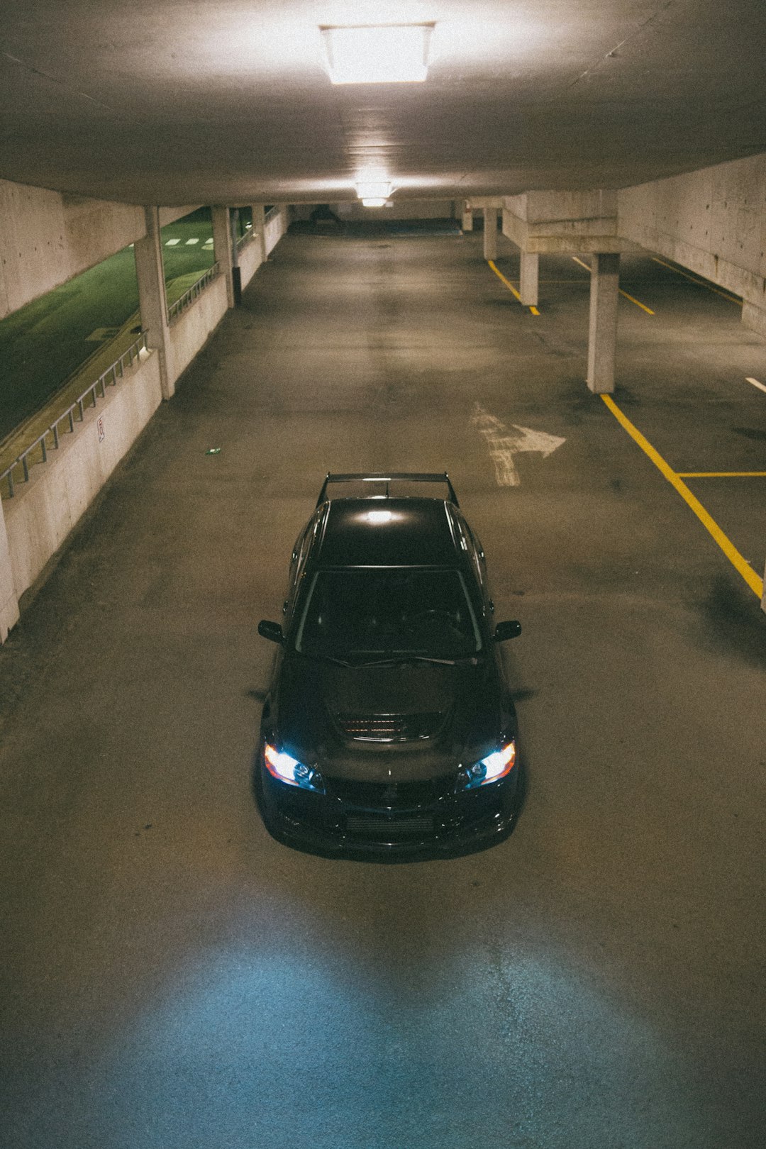 black car on gray concrete road