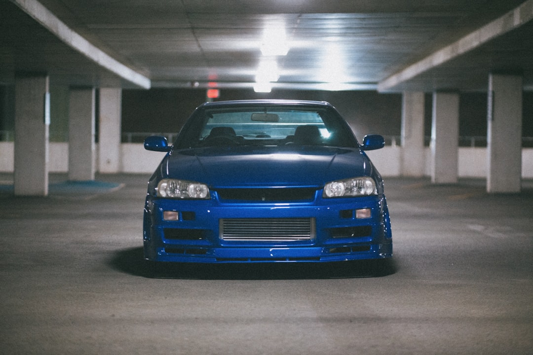 blue bmw car parked in garage