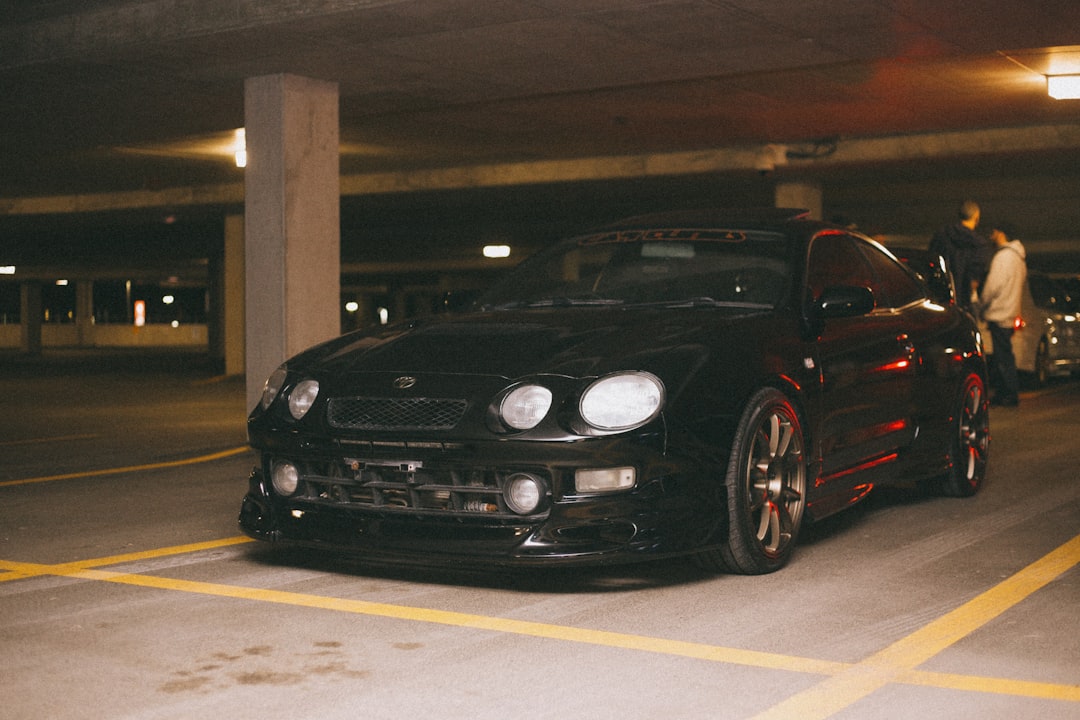 black bmw m 3 coupe parked on gray concrete floor