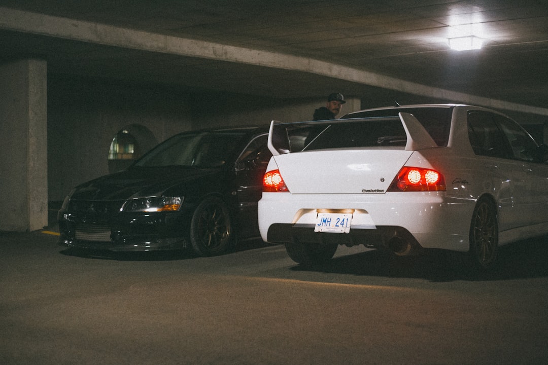 white and black car on parking lot