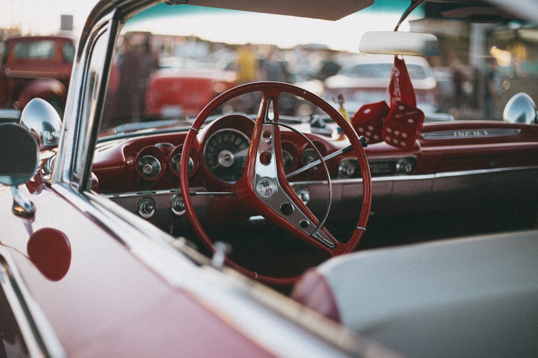 red and white car steering wheel