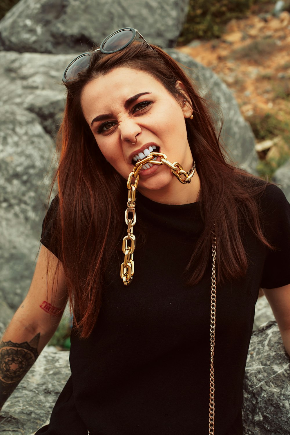 woman in black crew neck t-shirt with silver hoop earrings