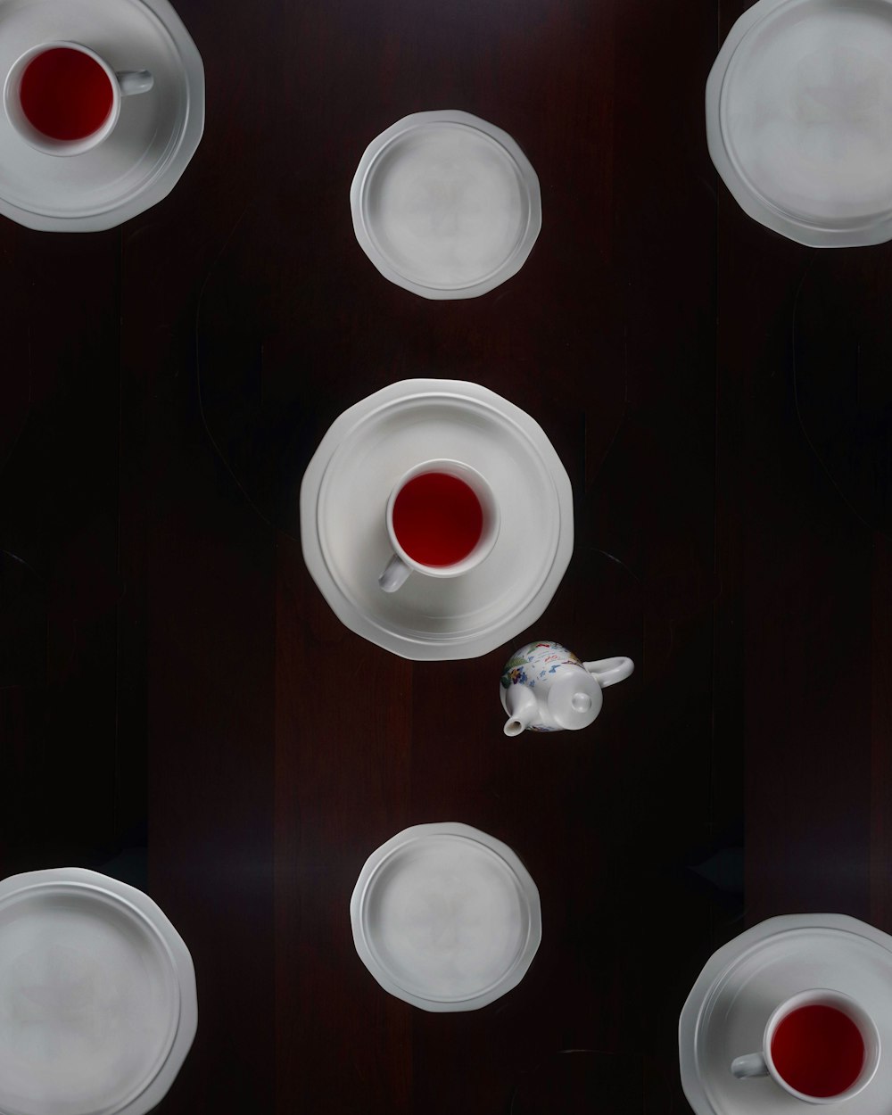white ceramic teacup on table