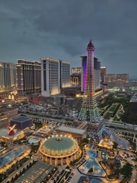 Luxurious residential towers with elegant lighting at dusk in Baghdad.