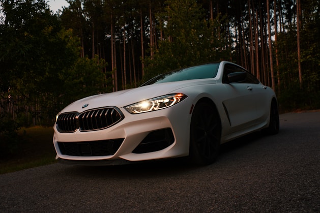 silver bmw m 3 coupe parked on gray asphalt road during daytime