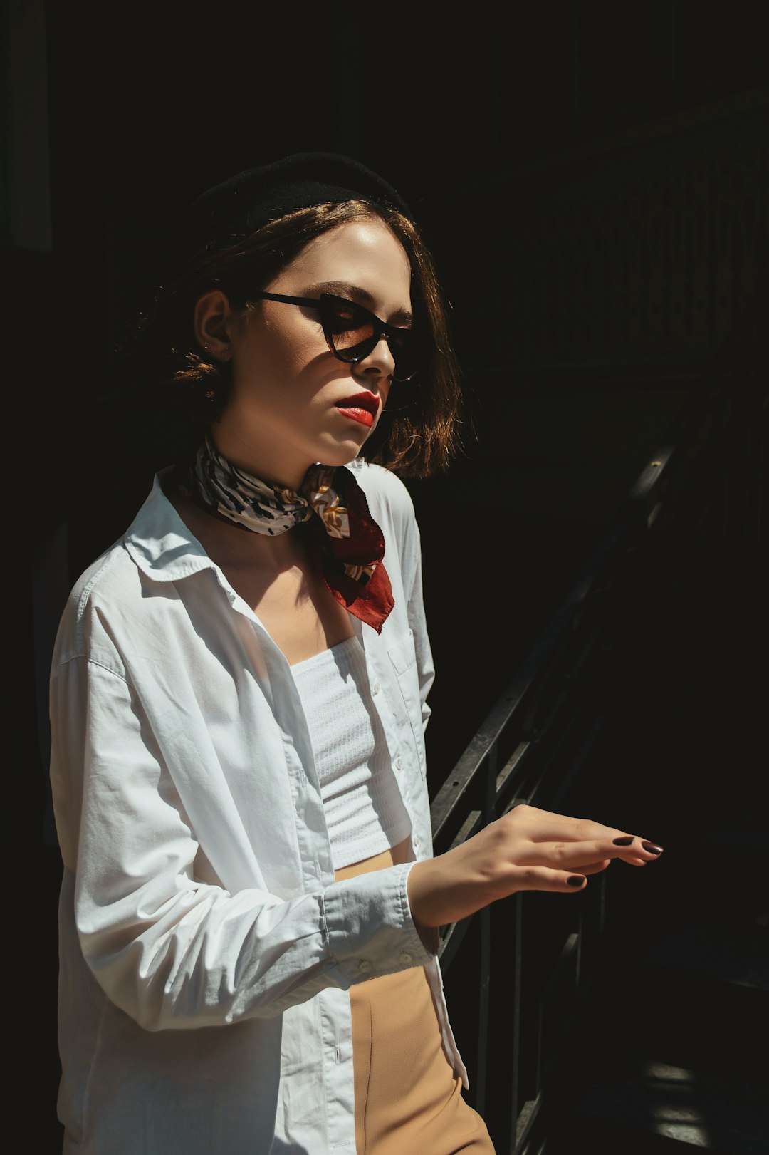 woman in white button up shirt wearing black framed eyeglasses