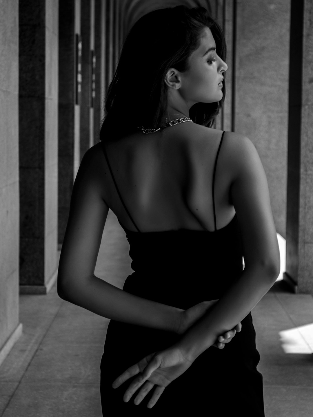 grayscale photo of woman in black tube dress