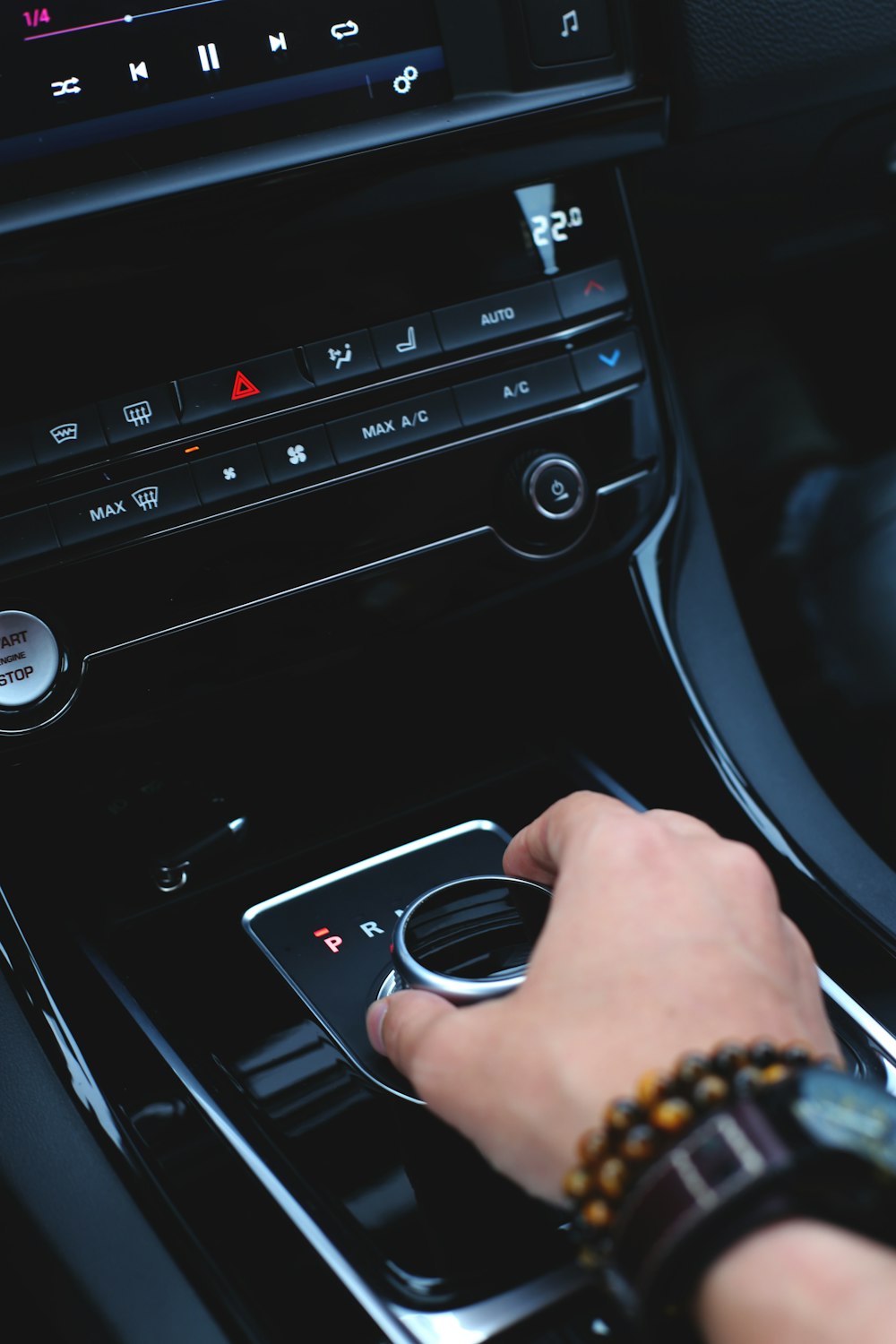 person holding silver ring in car