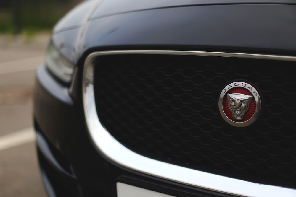 black nissan car in close up photography