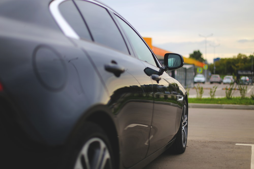 black sedan on road during daytime