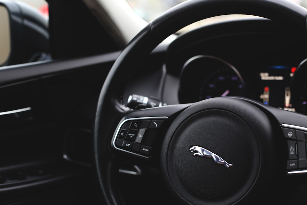 black and gray audi steering wheel