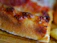 Close-up of a delicious, freshly baked pizza slice with melted cheese and toppings.