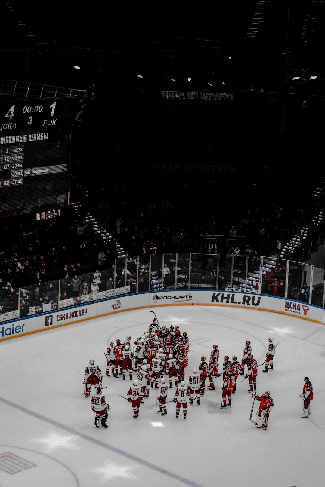 people playing ice hockey on ice stadium