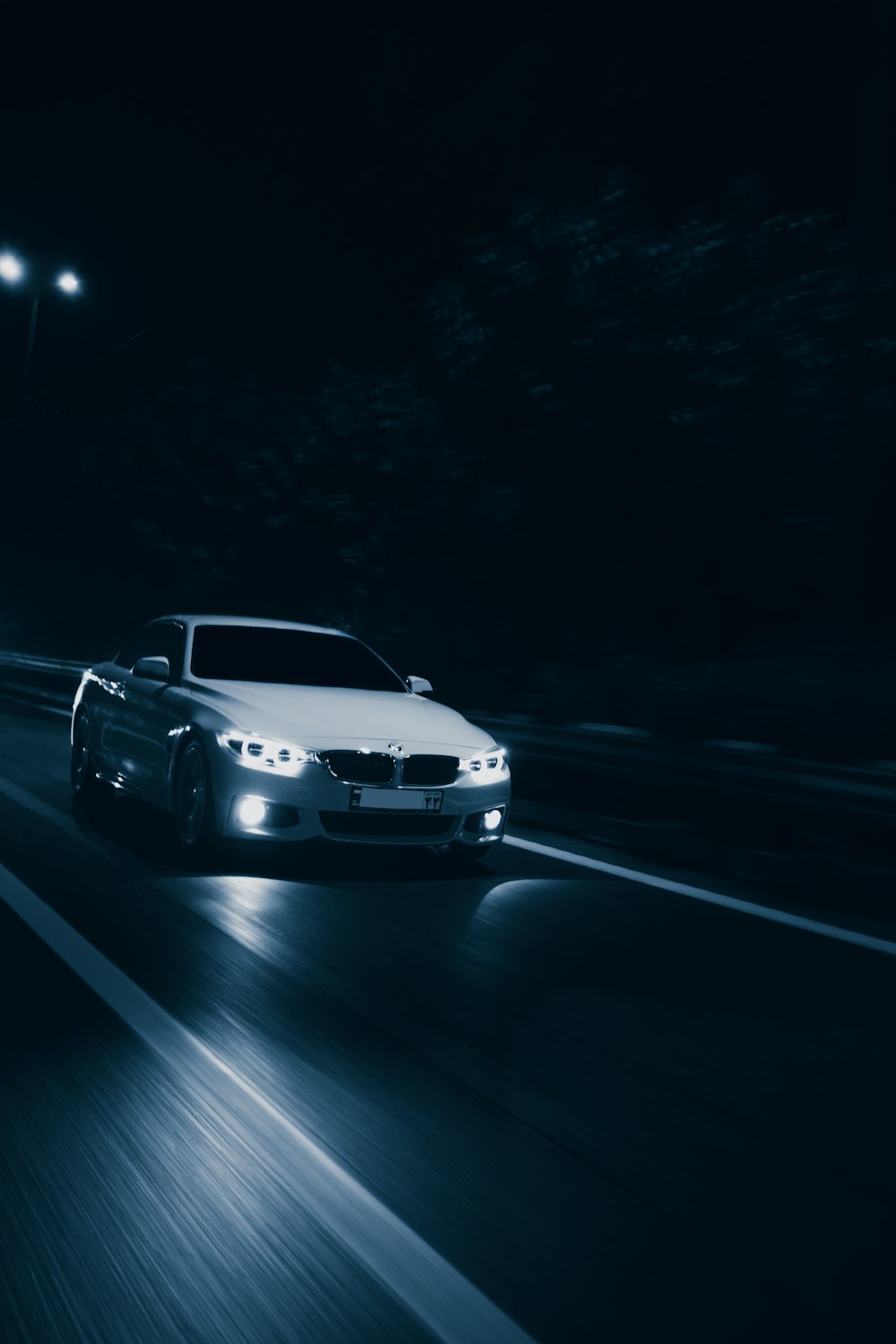 white bmw m 3 on road during night time