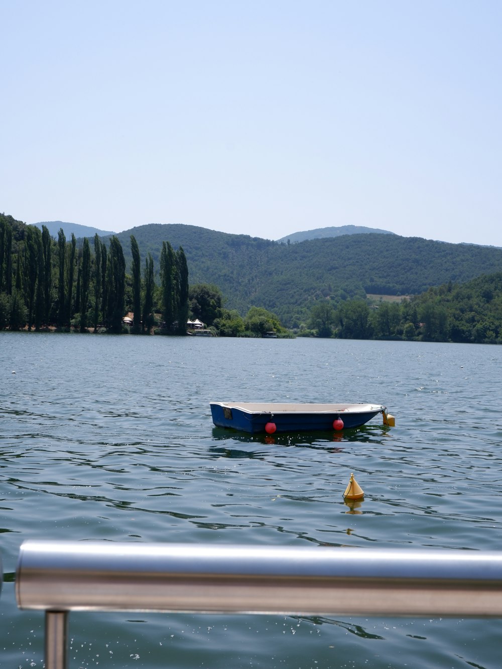 white and black boat on body of water during daytime