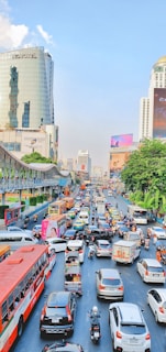 A busy street scene showcasing various vehicles on the road.