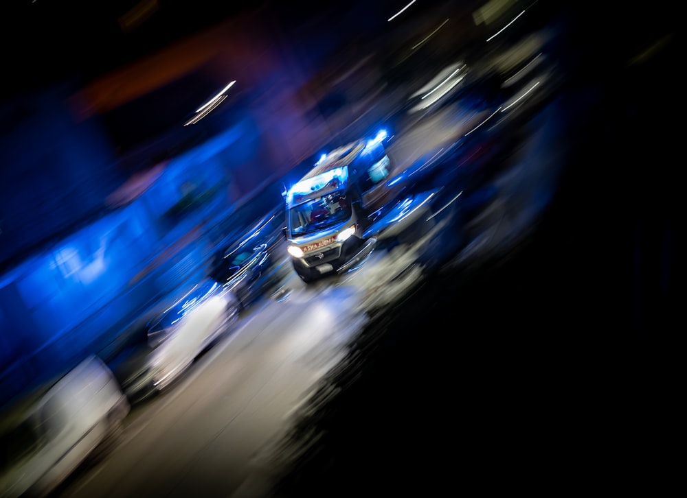 blue and white car on road