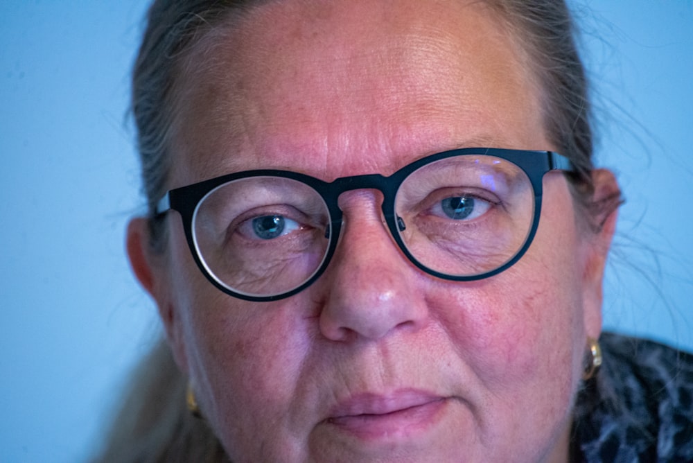 woman in black framed eyeglasses