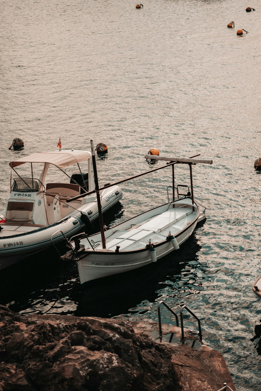 white and black boat on sea during daytime