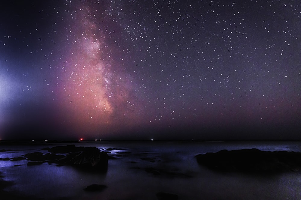 body of water under starry night