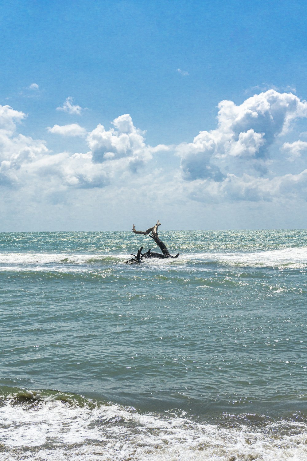 man surfing on sea during daytime