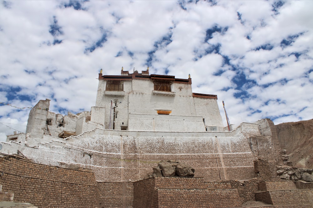 brown concrete building under blue sky during daytime