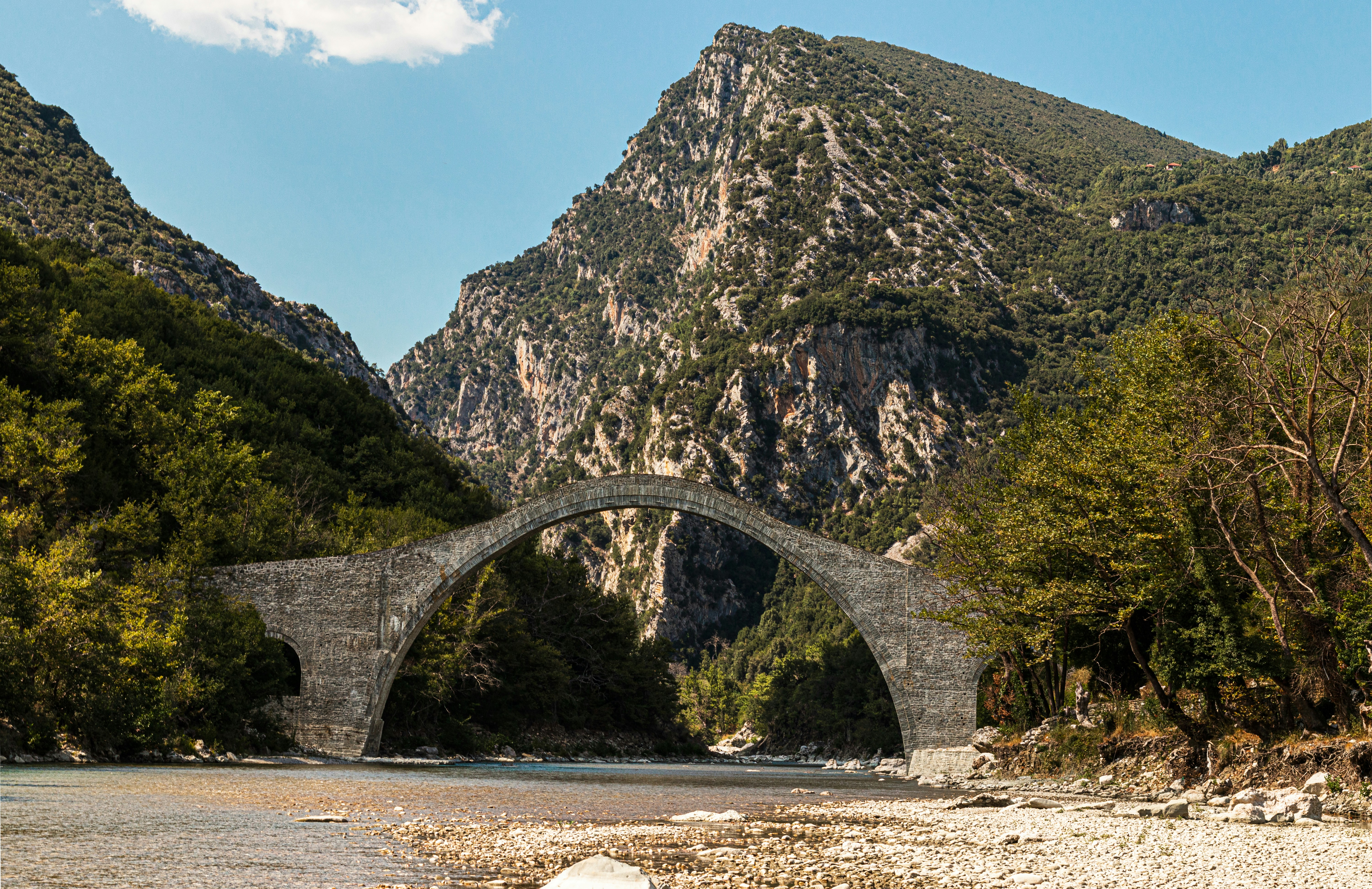 gray concrete bridge over the river