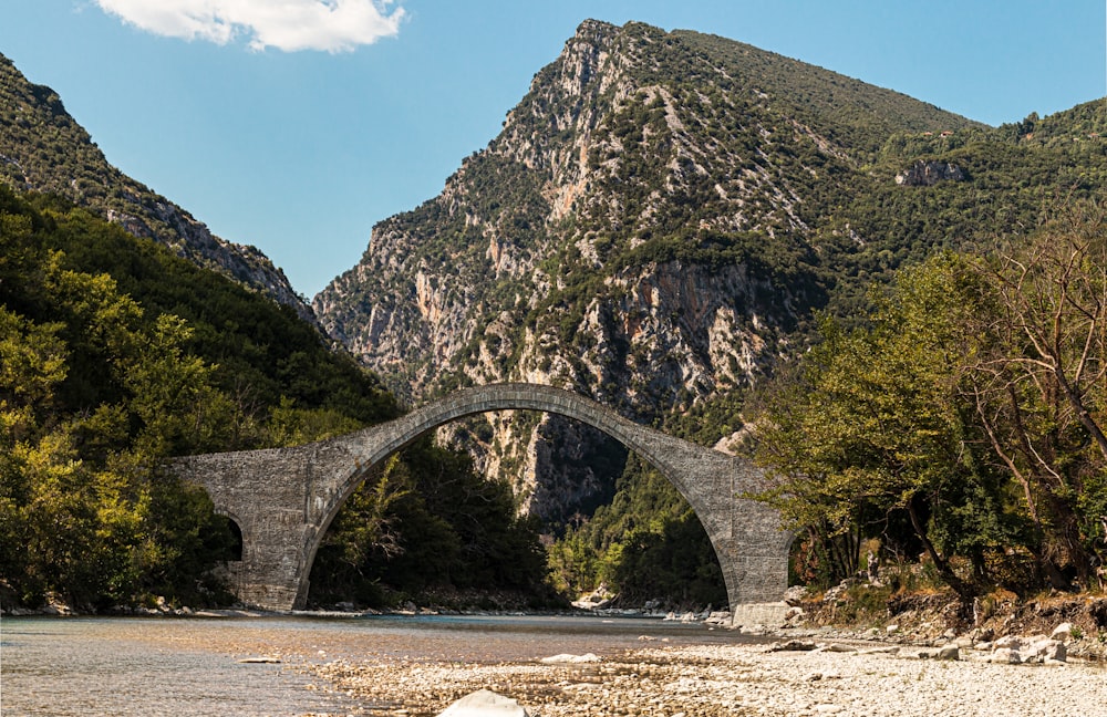 gray concrete bridge over the river